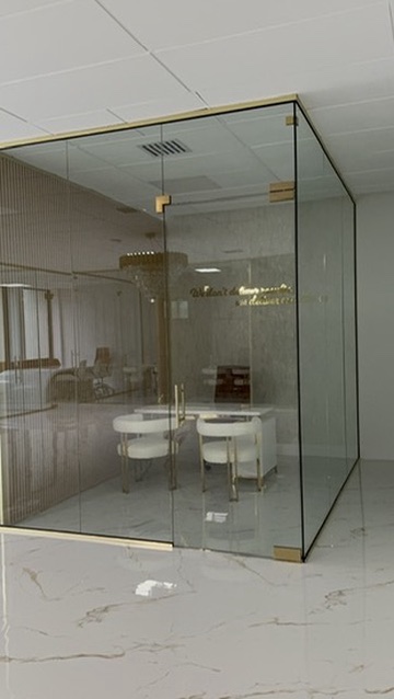 Glass office front with gold hardware