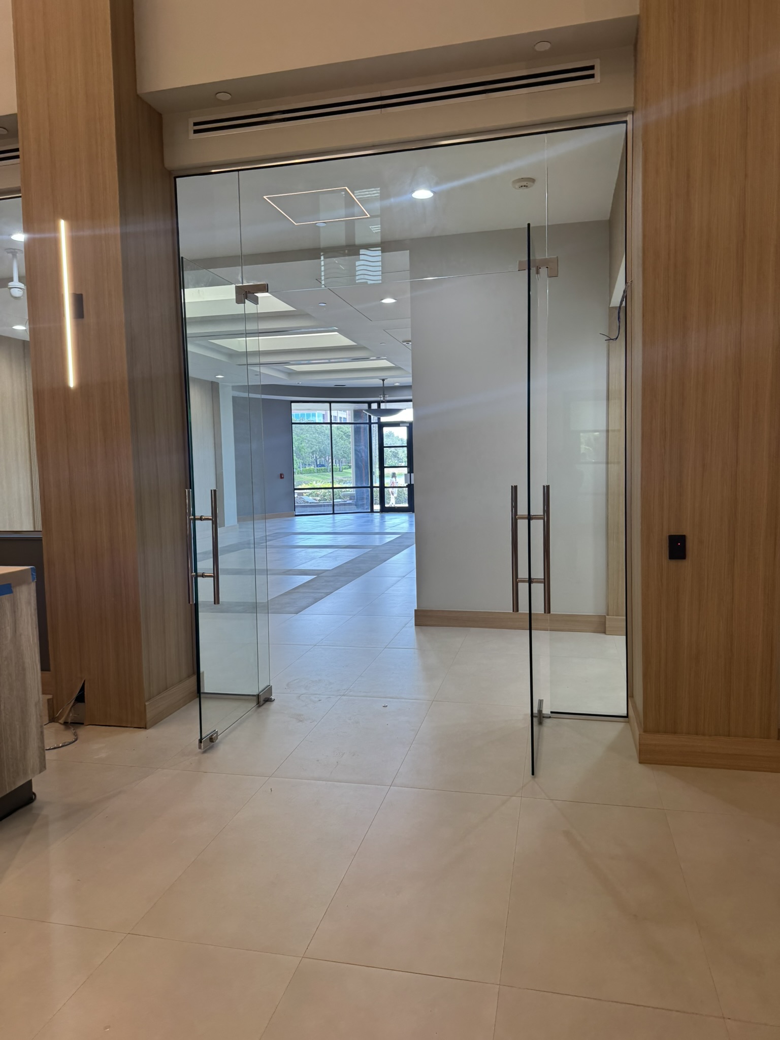Glass entry doors in commercial lobby
