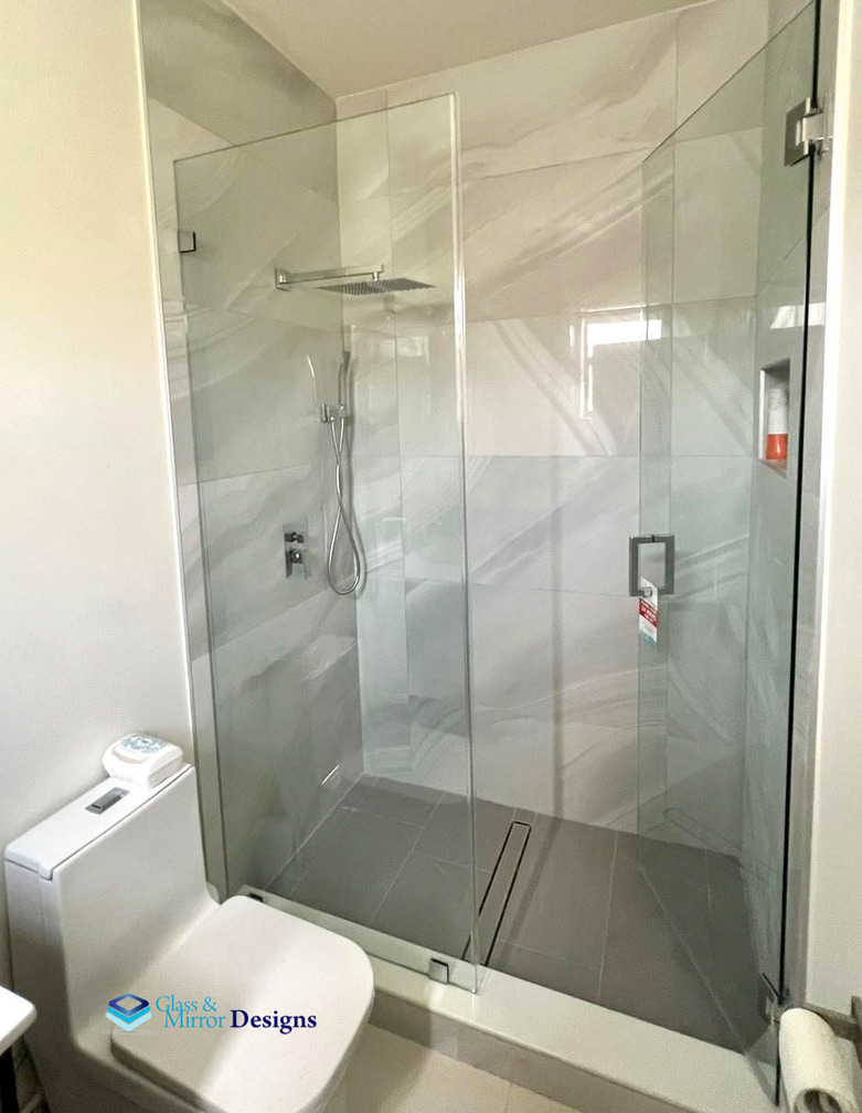 Frameless shower door with chrome hardware