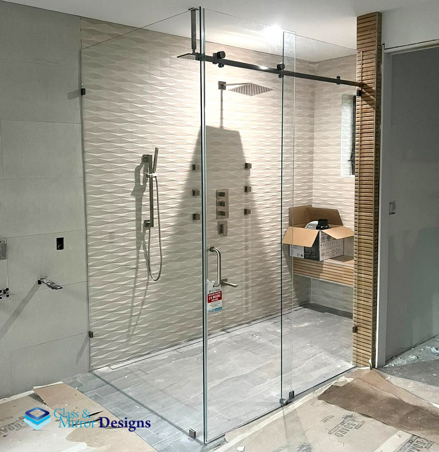 Sliding shower door with brushed nickel hardware