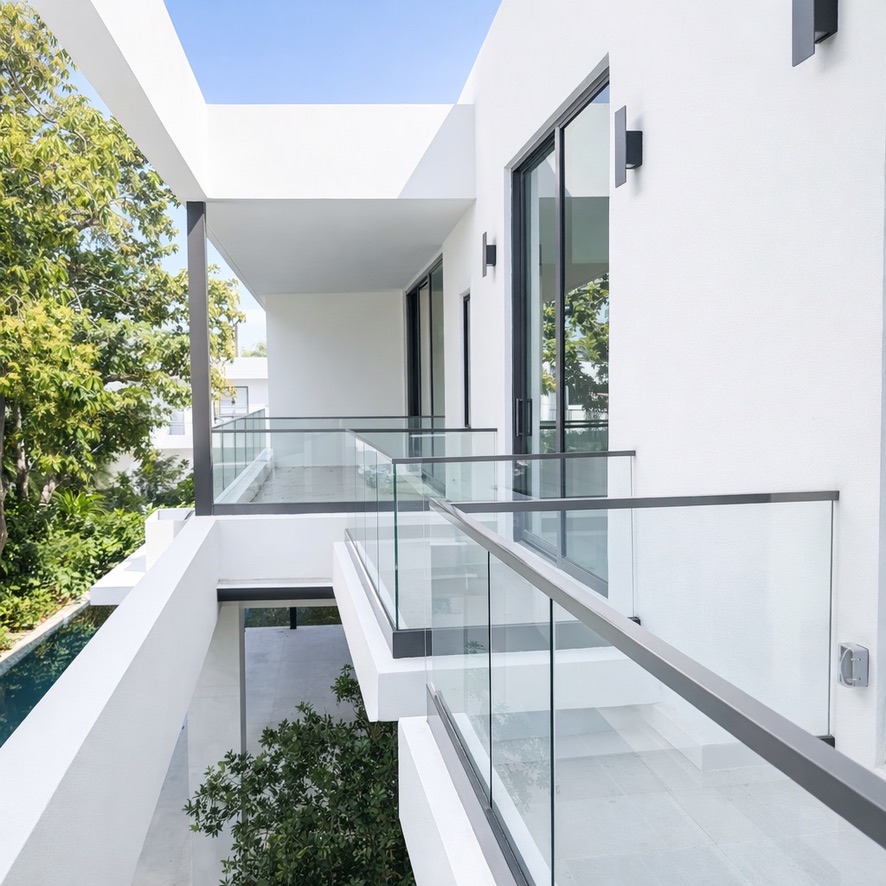 Sleek outdoor glass railing system that enhances views and modern architecture. Sleek outdoor glass railing system that enhances views and modern architecture.