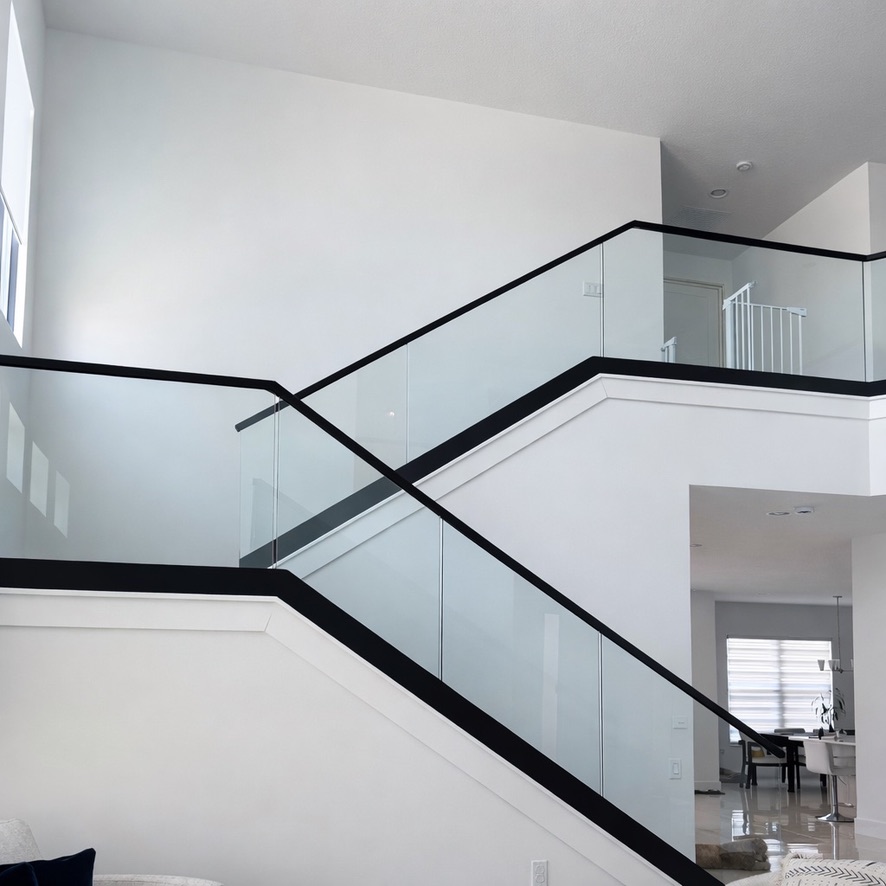 Frameless tempered glass railing designed to provide safety, elegance, and a clean modern look. Frameless tempered glass railing designed to provide safety, elegance, and a clean modern look.